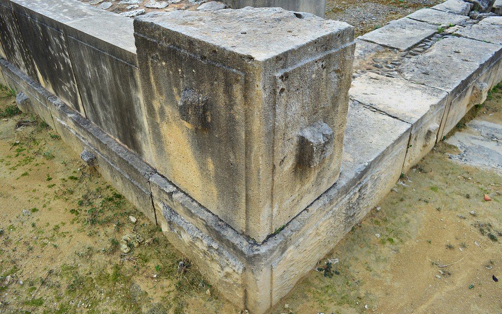 Image is of a quoin or cornerstone of a building.Quoining and lever bosses in Late Bronze Age Cypriot ashlar masonry. Alassa, active during the 13th century BC.