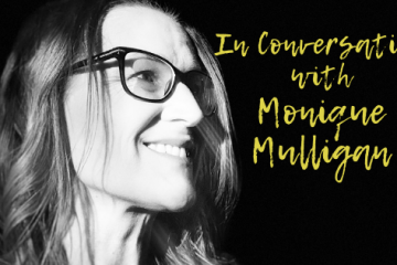 ID: Black-and-white headshot of author Monique Mulligan. She is wearing glasses and smiling at something off-camera. In yellow are the words, "In Conversation with Monique Mulligan".